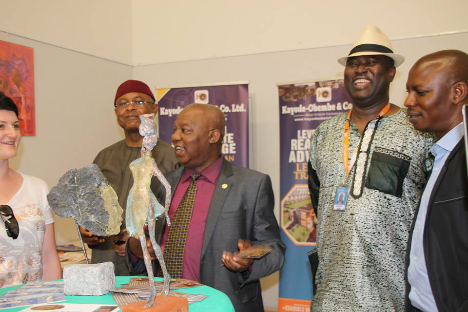 The Charge d Affaires of the Embassy / Permanent Mission of the Federal Republic of Nigeria to Austria and Slovakia, Mr. Gazing J. N. Dangtim, viewing Nigerian craftworks